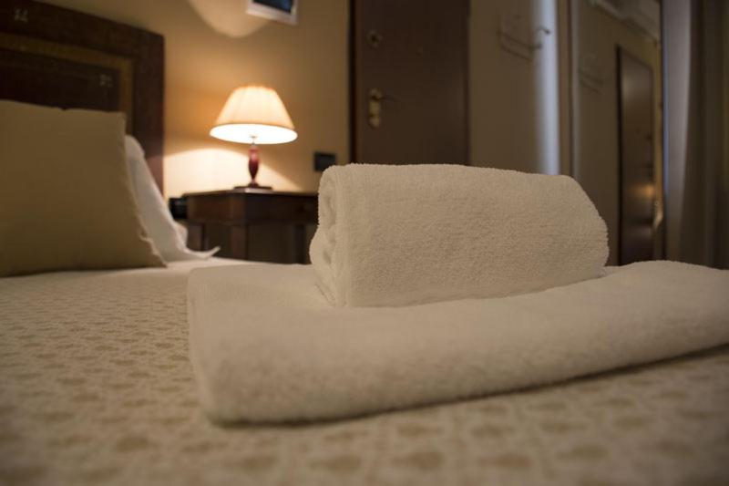 A bed or beds in a room at Agriturismo Scuderie della Contea