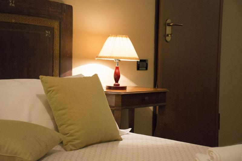 A bed or beds in a room at Agriturismo Scuderie della Contea