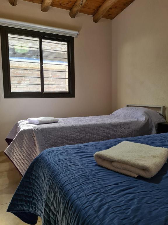 Postel nebo postele na pokoji v ubytování CASA TUNUYÁN