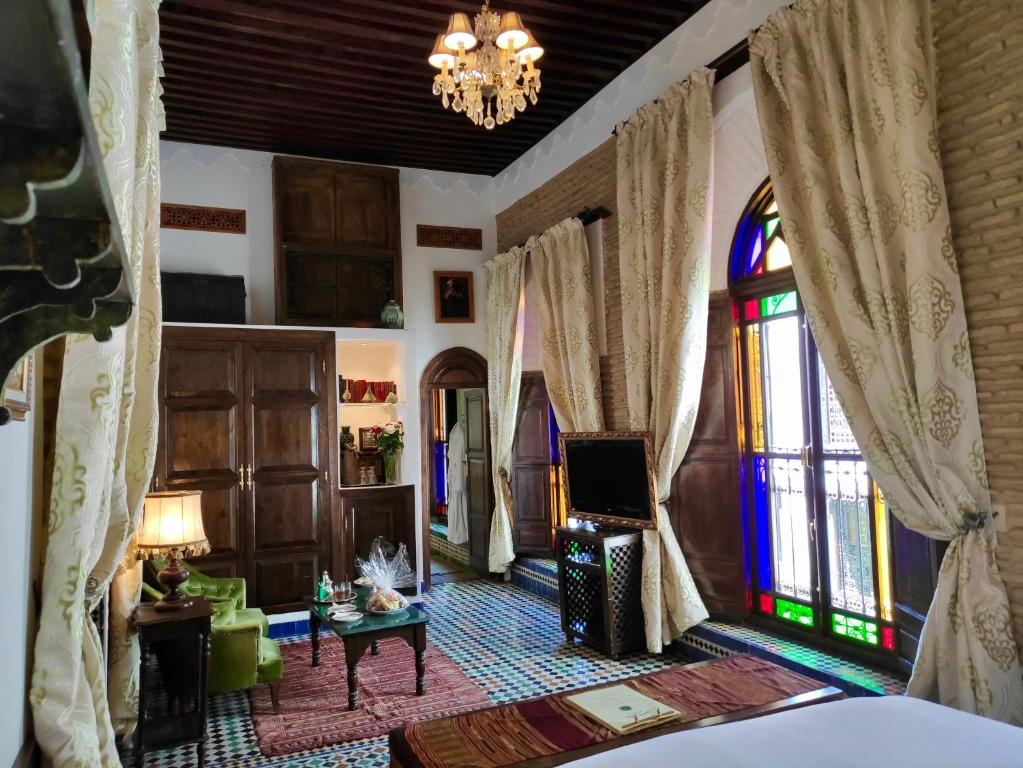 Postel nebo postele na pokoji v ubytování Riad Le Calife