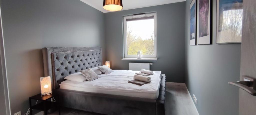 Posteľ alebo postele v izbe v ubytovaní Labo Apartment Fort Wola