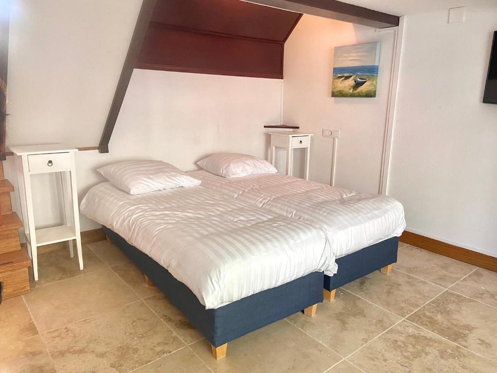 Postel nebo postele na pokoji v ubytování Bed & Ontbijt Haddock