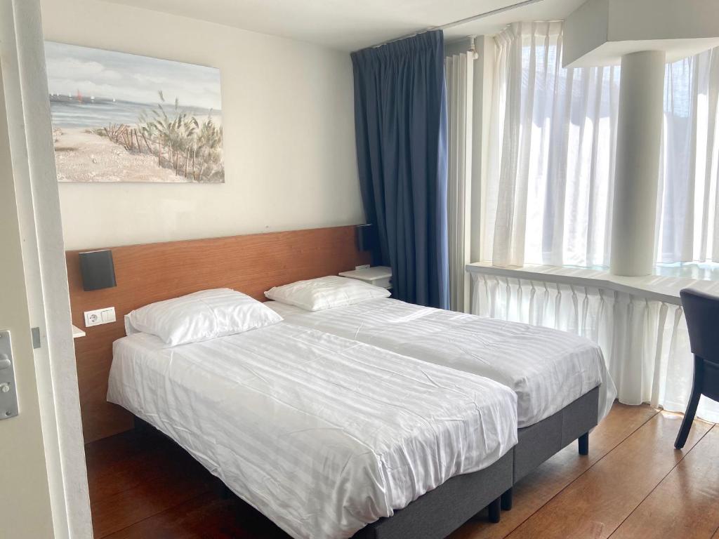 Postel nebo postele na pokoji v ubytování Bed & Ontbijt Haddock