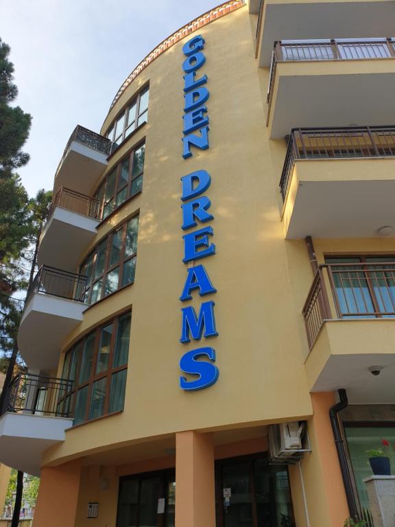 a hotel sign on the side of a building at Golden Dreams in Sunny Beach