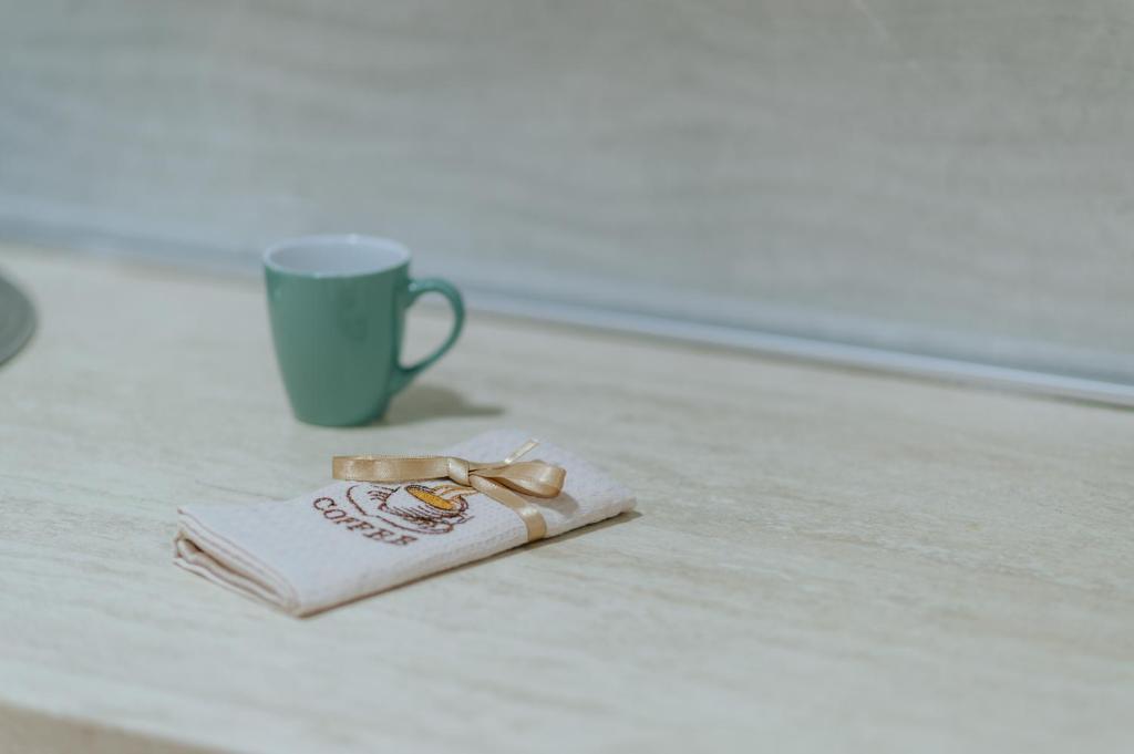 a napkin and a cup of coffee on a table at Apartmani Panorama in Bar