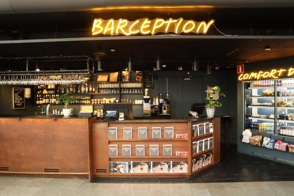 a barbershop with a counter and a barber shop at Comfort Hotel Xpress Stockholm Central in Stockholm