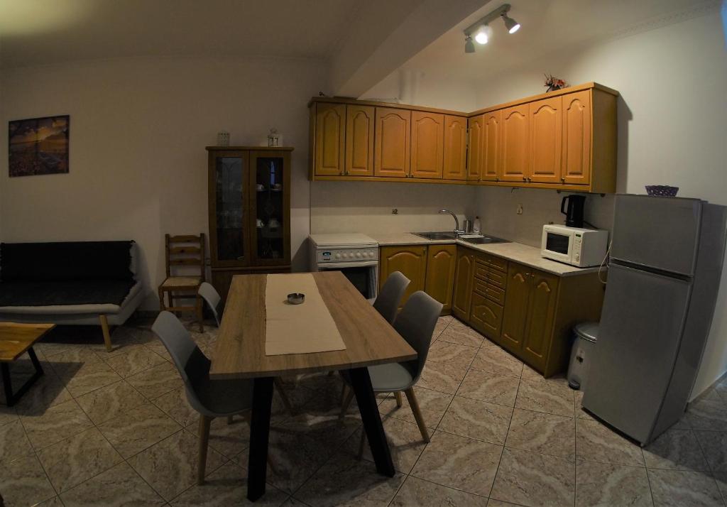 Kuchyň nebo kuchyňský kout v ubytování Galaxy Rooms
