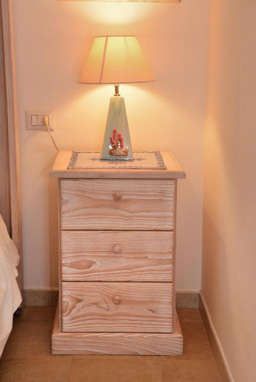 A bed or beds in a room at Porto Cervo Suite Apartment