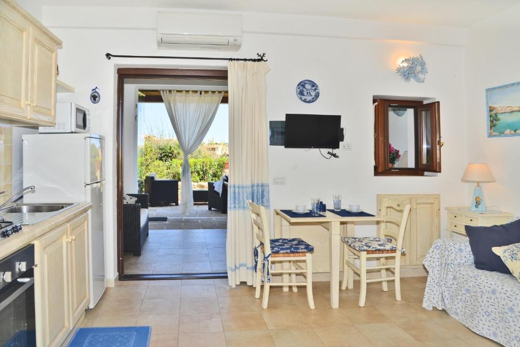 A kitchen or kitchenette at Porto Cervo Suite Apartment