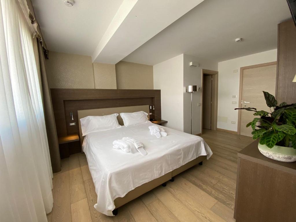 Postel nebo postele na pokoji v ubytování Grand Hotel Miramonti