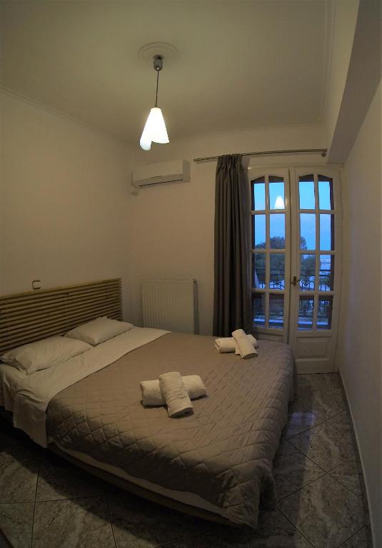 Postel nebo postele na pokoji v ubytování Galaxy Rooms