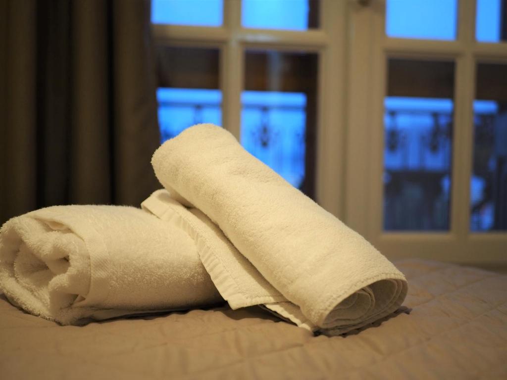 Postel nebo postele na pokoji v ubytování Galaxy Rooms