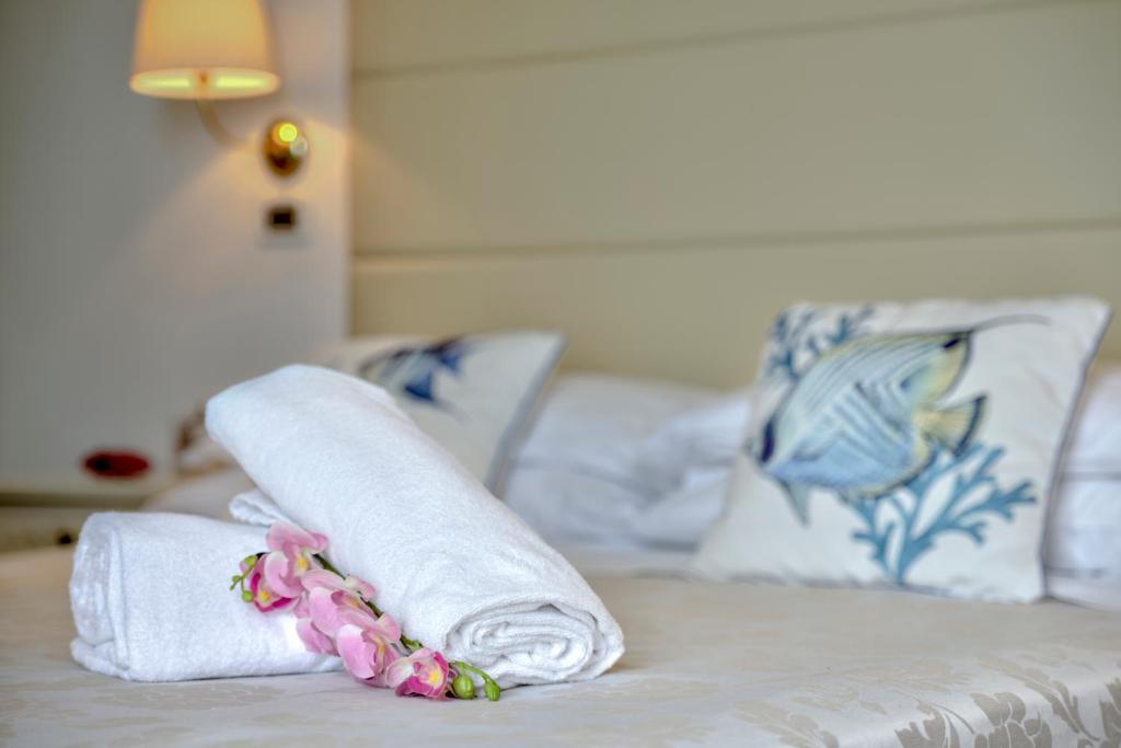 Postel nebo postele na pokoji v ubytování Hotel Carlton Beach