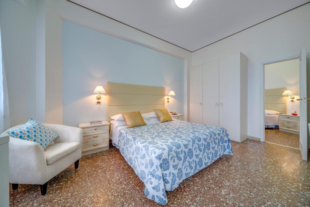 Postel nebo postele na pokoji v ubytování Hotel Carlton Beach