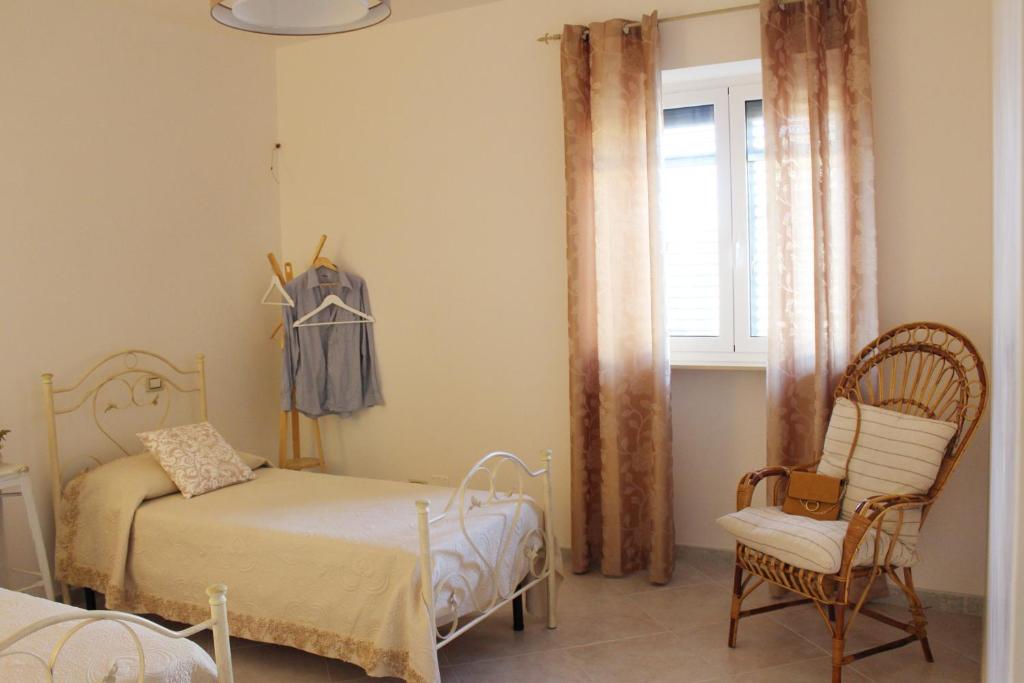 A bed or beds in a room at De Mola Holiday House