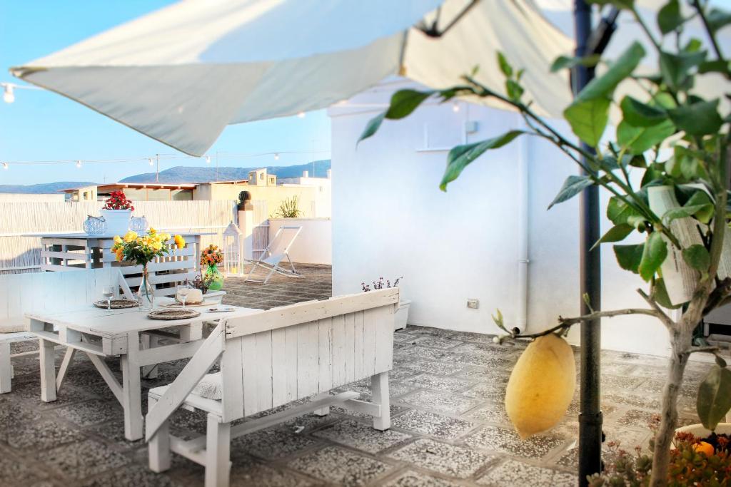A patio or other outdoor area at De Mola Holiday House