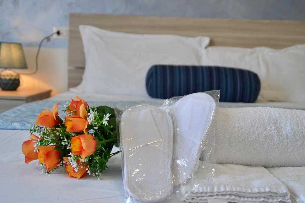 Postel nebo postele na pokoji v ubytování Sperlonga Paradise Suites 500m dal mare in estate Servizio navetta per Sperlonga centro