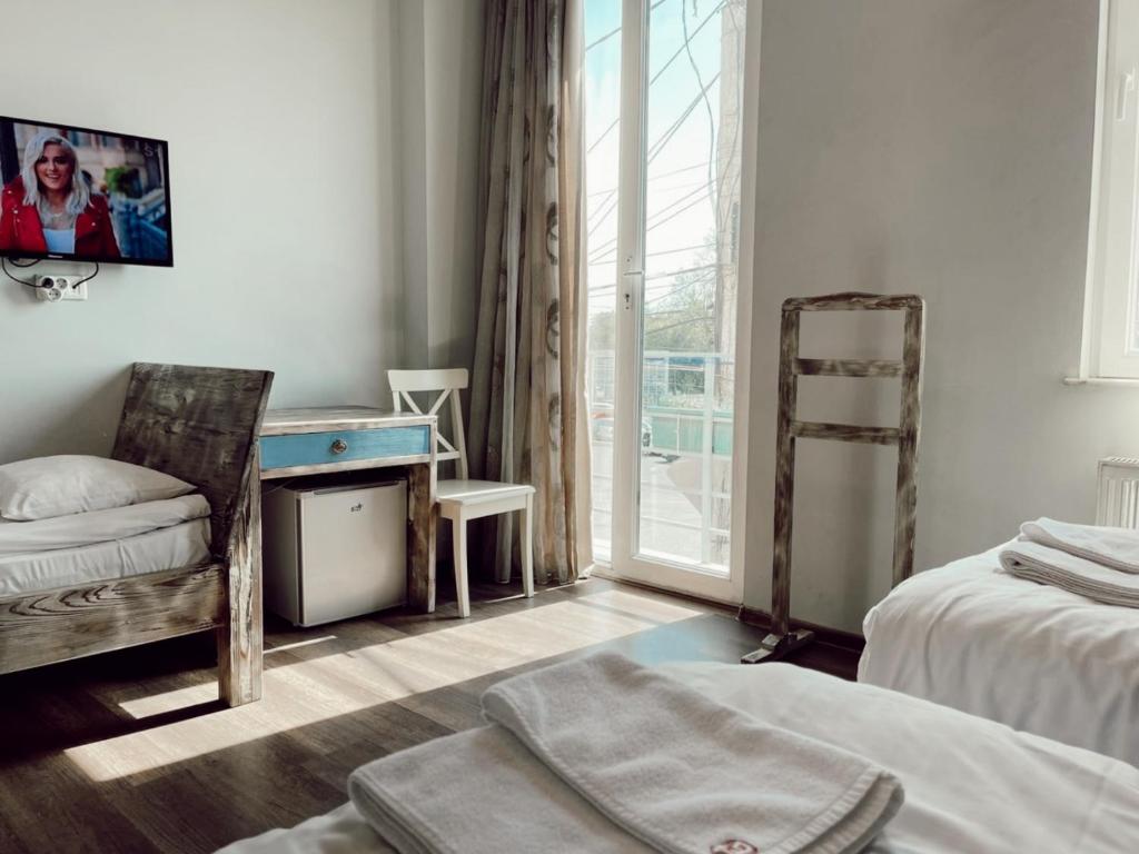 Postel nebo postele na pokoji v ubytování Hotel Kutaisi Globus