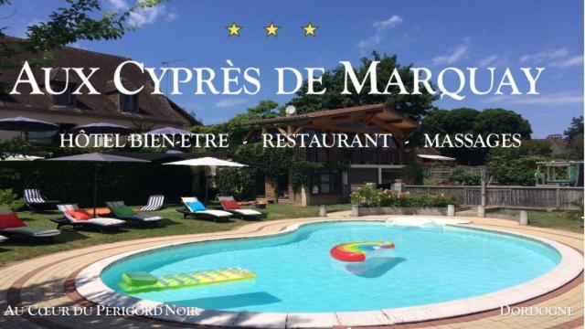 a sign for a resort with a swimming pool at Hôtel Bien-Être Aux Cyprès de Marquay in Marquay