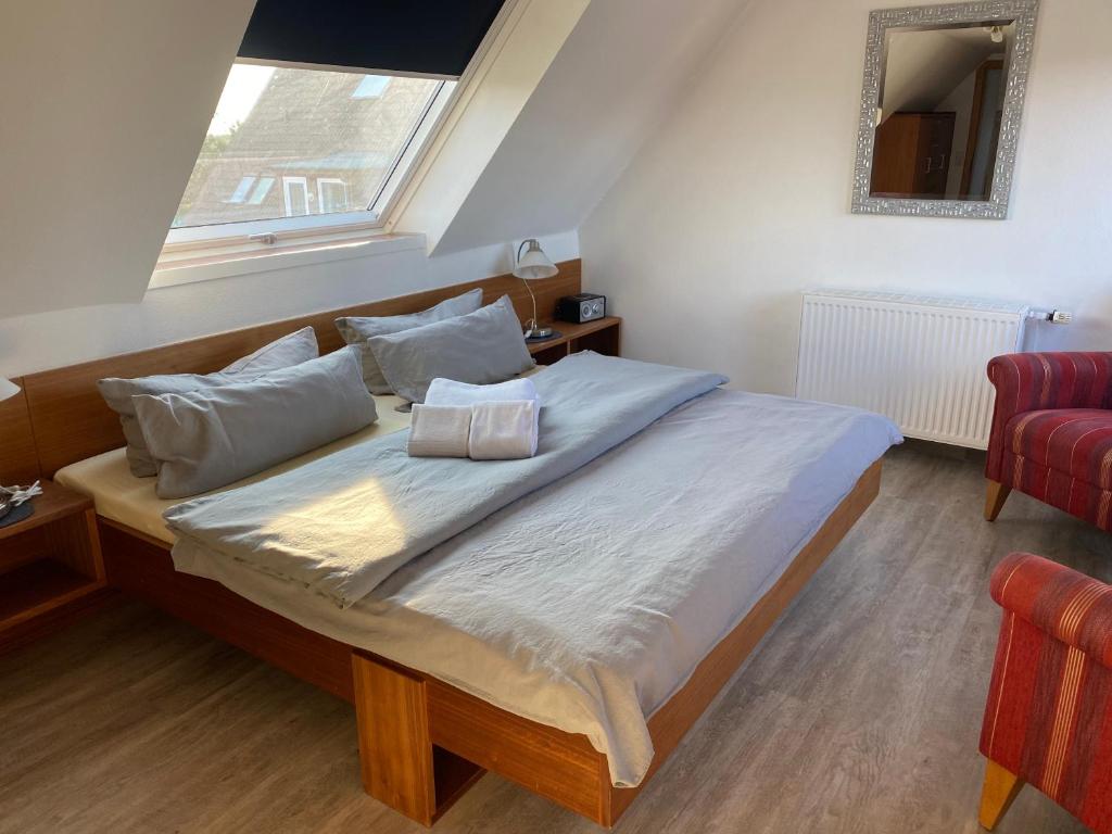 Postel nebo postele na pokoji v ubytování Haus Kap Horn