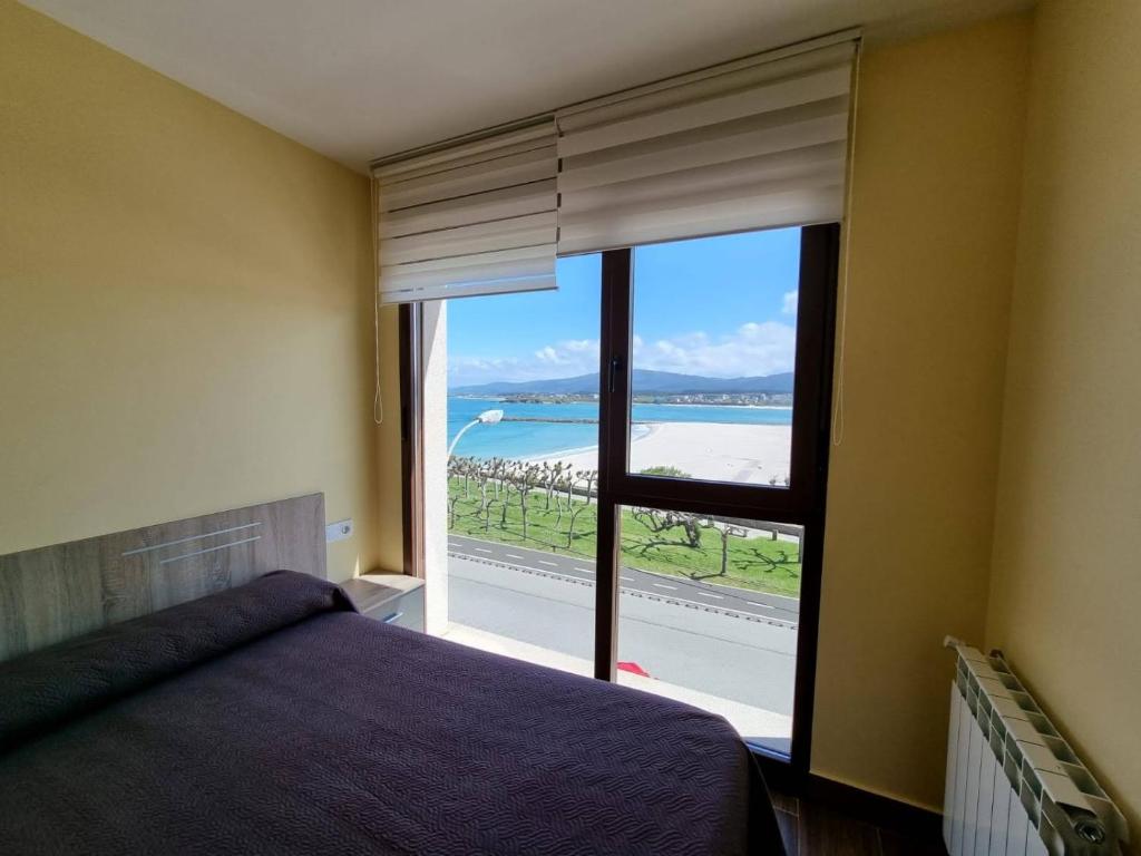 Posteľ alebo postele v izbe v ubytovaní Foz Playa Rapadoira - 3 dormitorios