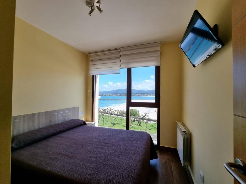 Posteľ alebo postele v izbe v ubytovaní Foz Playa Rapadoira - 3 dormitorios