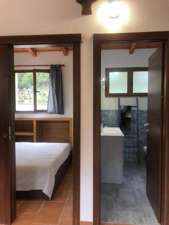 Postel nebo postele na pokoji v ubytování Wild sud Sardinia