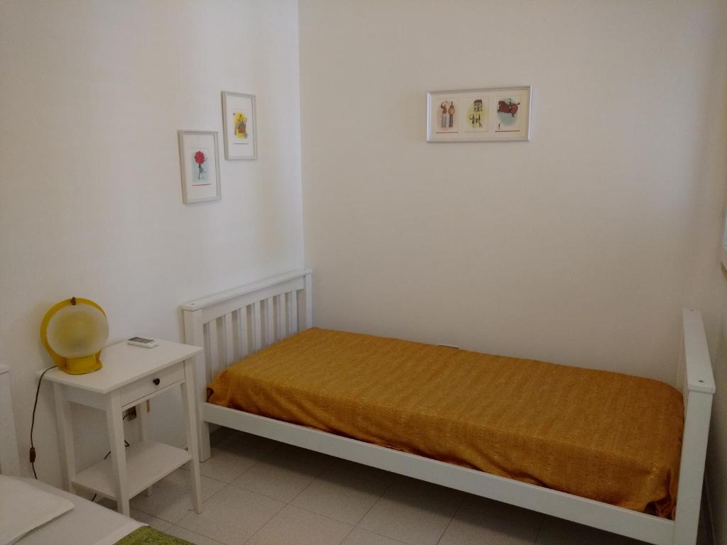 Łóżko lub łóżka w pokoju w obiekcie Villetta Porto Selvaggio