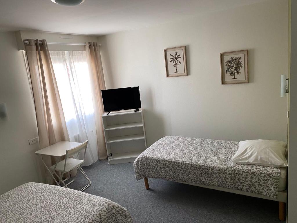 Postel nebo postele na pokoji v ubytování Hôtel du Littoral