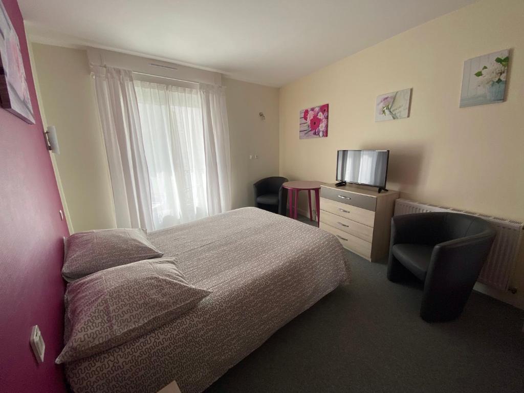 Postel nebo postele na pokoji v ubytování Hôtel du Littoral