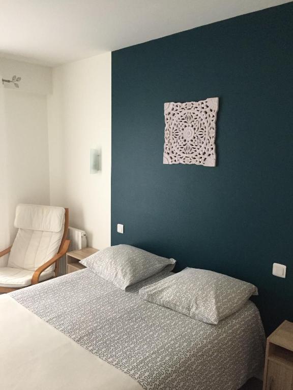 Postel nebo postele na pokoji v ubytování Hôtel du Littoral