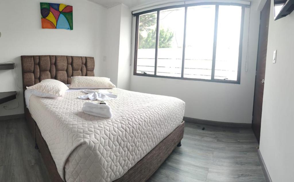 Postel nebo postele na pokoji v ubytování Hotel Kristal Ferial