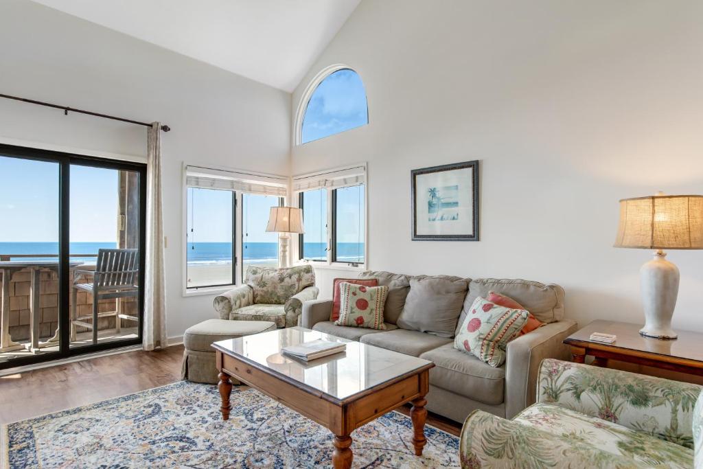 a living room with a couch and a table at Windswept 4309 in Kiawah Island