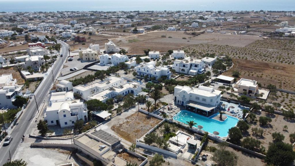 an aerial view of a city with white buildings at The Three anchors Rooms Perissa in Perissa