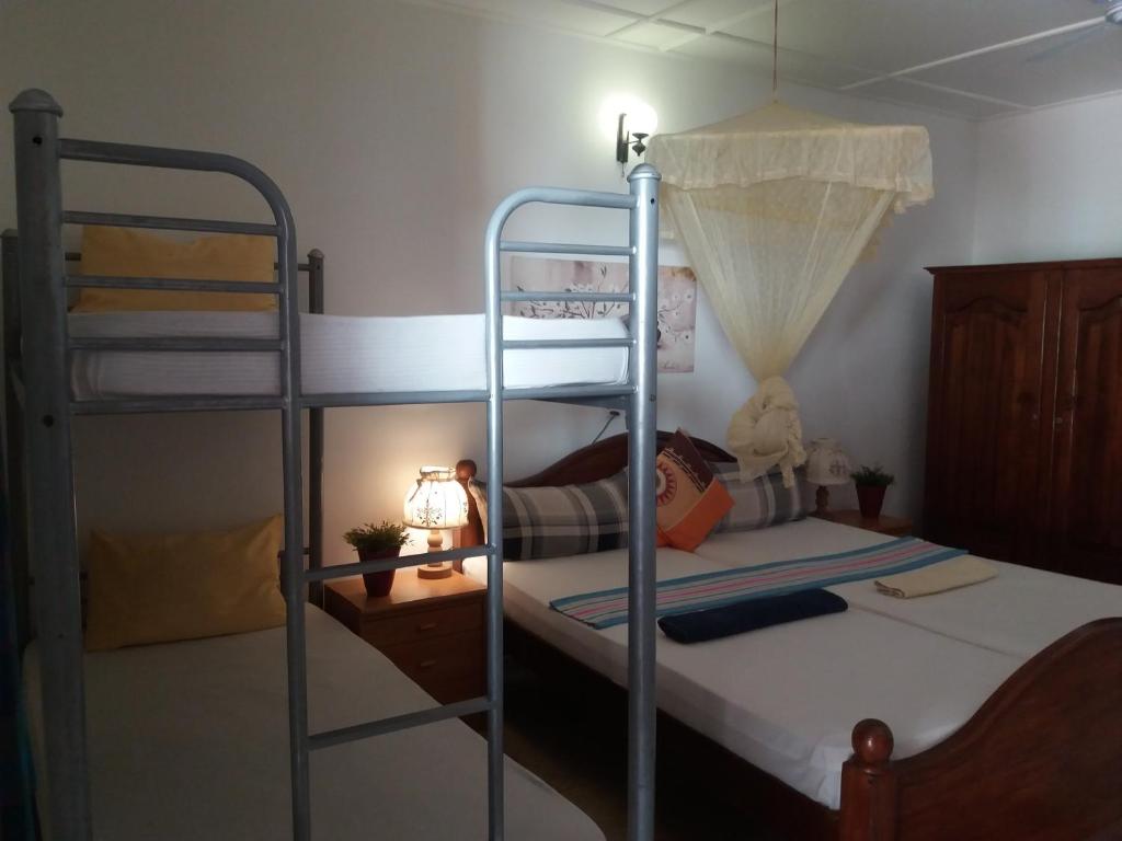 Postel nebo postele na pokoji v ubytování Embiente Guest House
