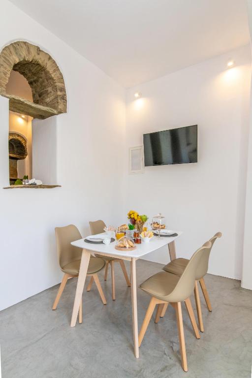 A television and/or entertainment centre at Livadi house Tinos 2 katwi