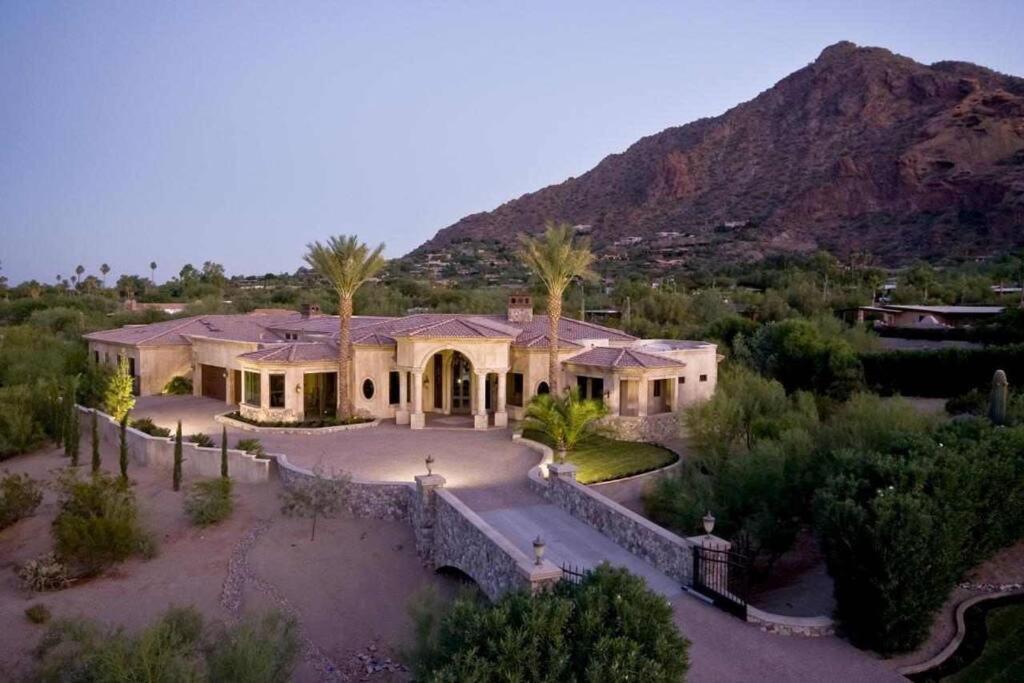 an aerial view of a house with a mountain at Camelback Mountain Mansion in Paradise Valley, AZ in Scottsdale