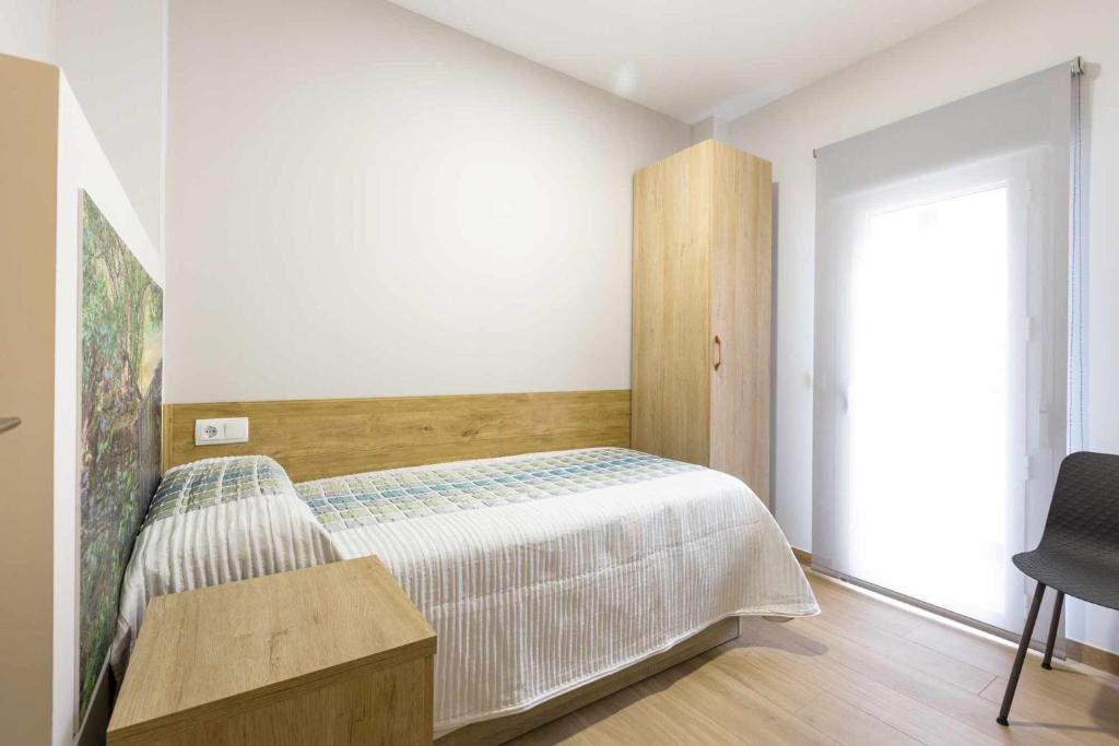 Postel nebo postele na pokoji v ubytování Las tres puertas