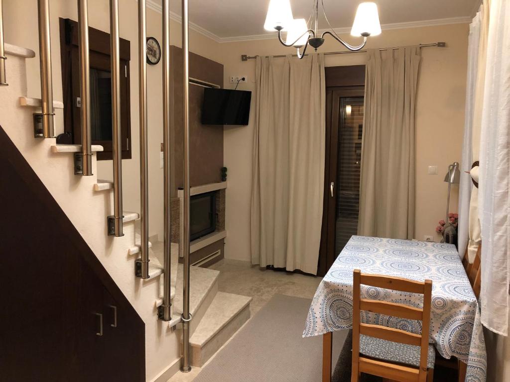 Televízia a/alebo spoločenská miestnosť v ubytovaní AM Beach House