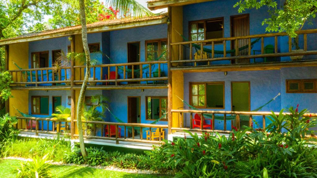 Um jardim no exterior de Atmosphera Pousada