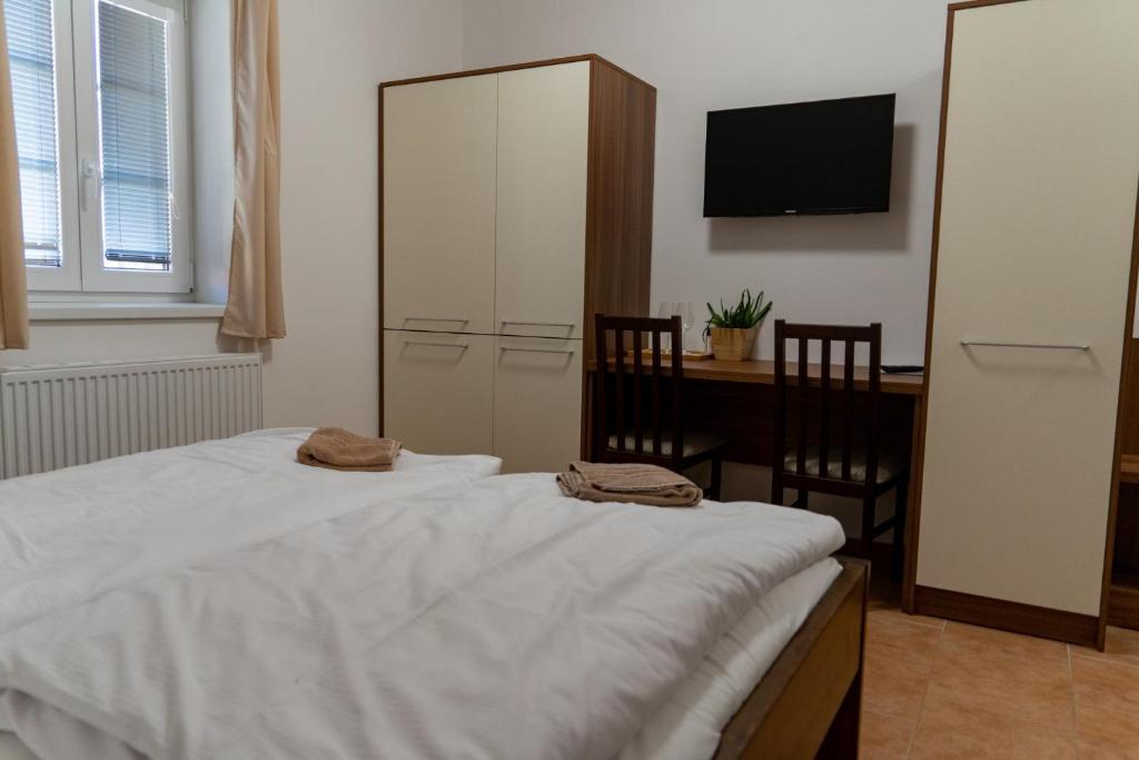 Postel nebo postele na pokoji v ubytování Pension Restaurace Florián