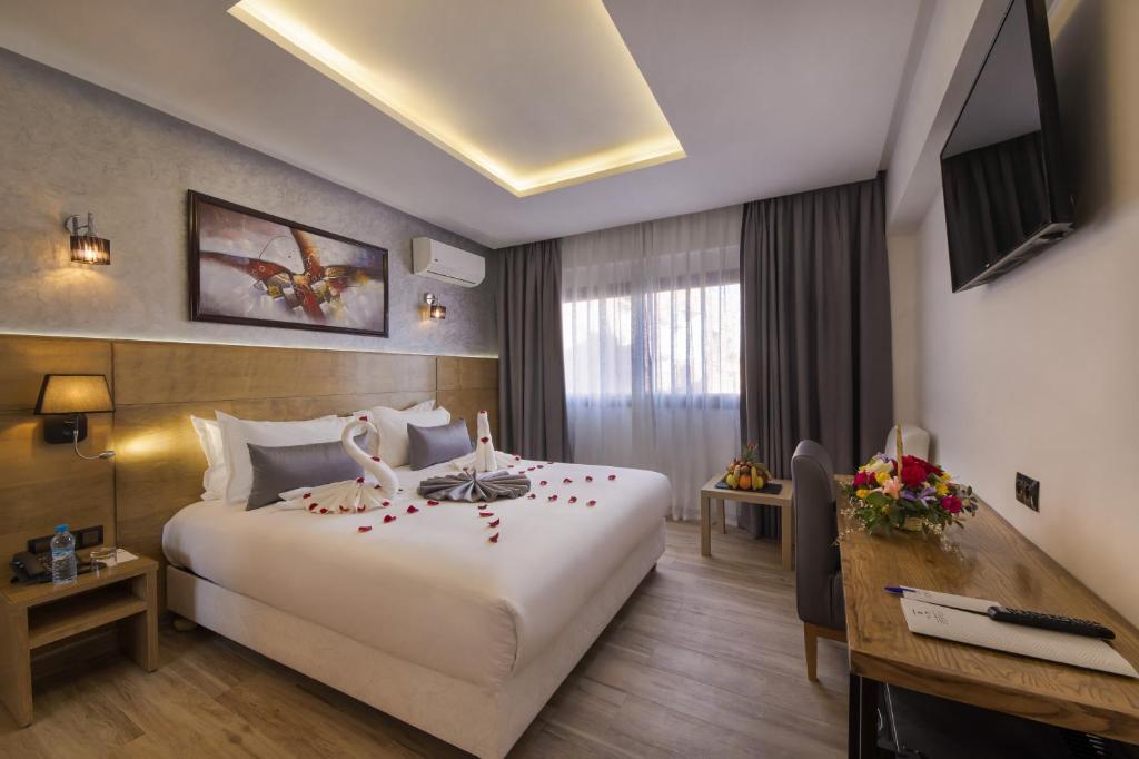 Postel nebo postele na pokoji v ubytování Stars Hotel & Spa