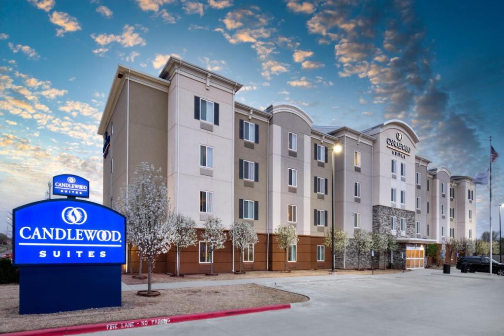 a rendering of a building with a sign in front of it at Candlewood Suites Enid, an IHG Hotel in Enid