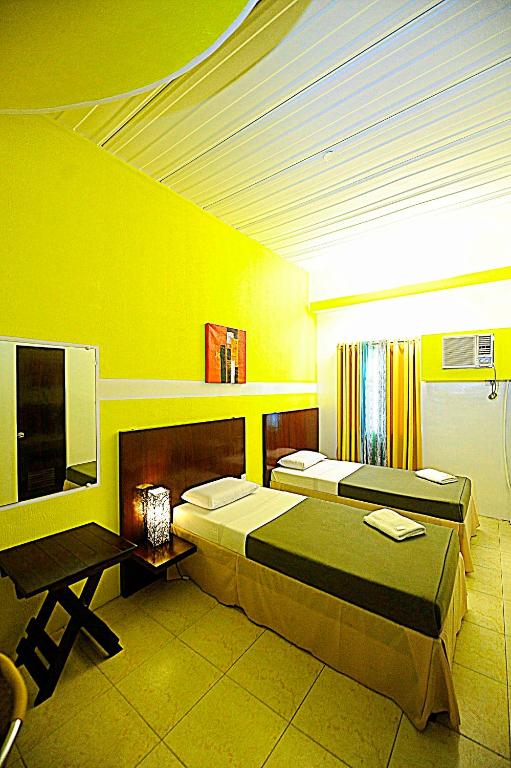 Postel nebo postele na pokoji v ubytování First Pacific Inn Davao