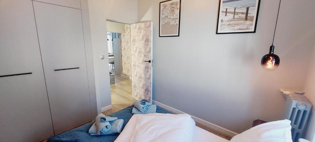 Posteľ alebo postele v izbe v ubytovaní Central Apartments Astoria 2
