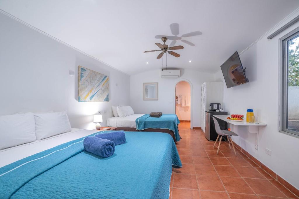 Postel nebo postele na pokoji v ubytování Hotel Pasatiempo