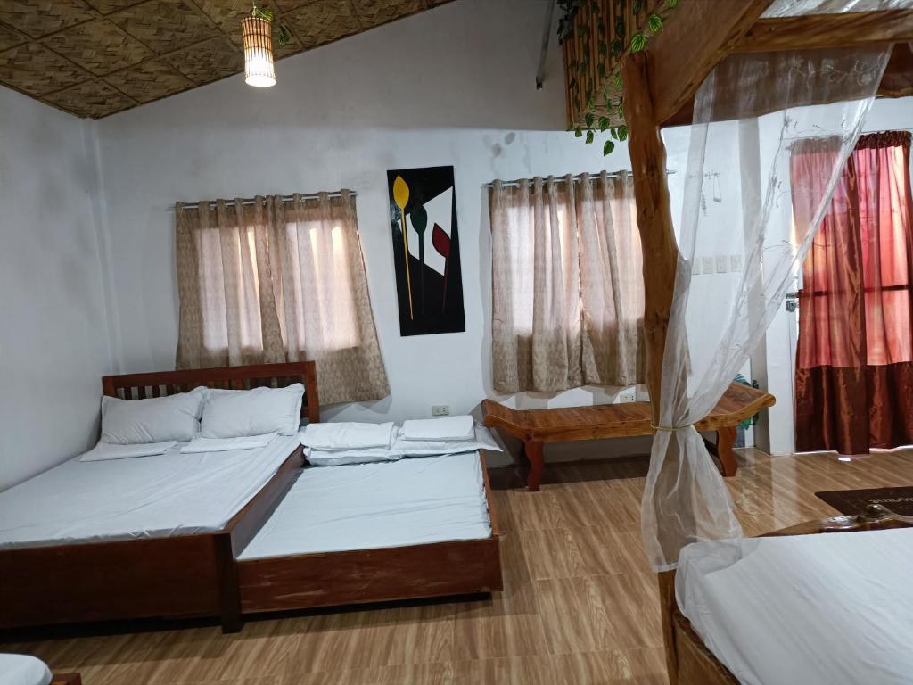 Postel nebo postele na pokoji v ubytování ANNI'S BEACH HOUSE