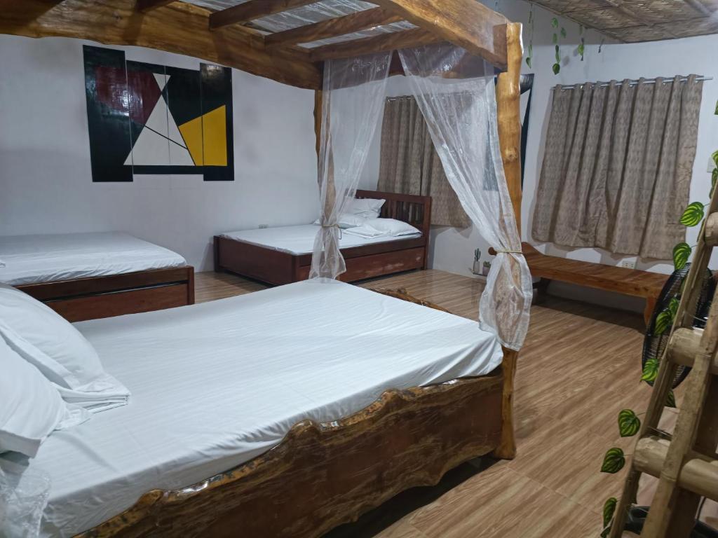 Postel nebo postele na pokoji v ubytování ANNI'S BEACH HOUSE
