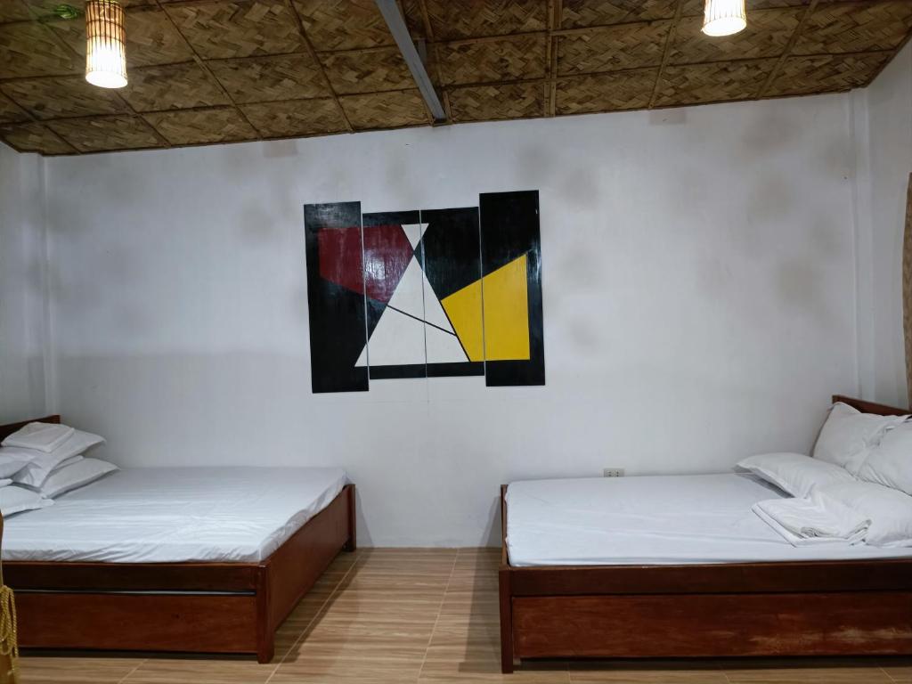 Postel nebo postele na pokoji v ubytování ANNI'S BEACH HOUSE