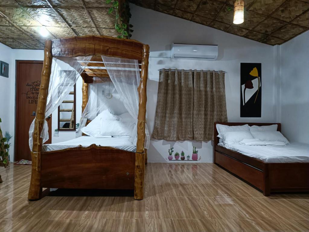 Postel nebo postele na pokoji v ubytování ANNI'S BEACH HOUSE